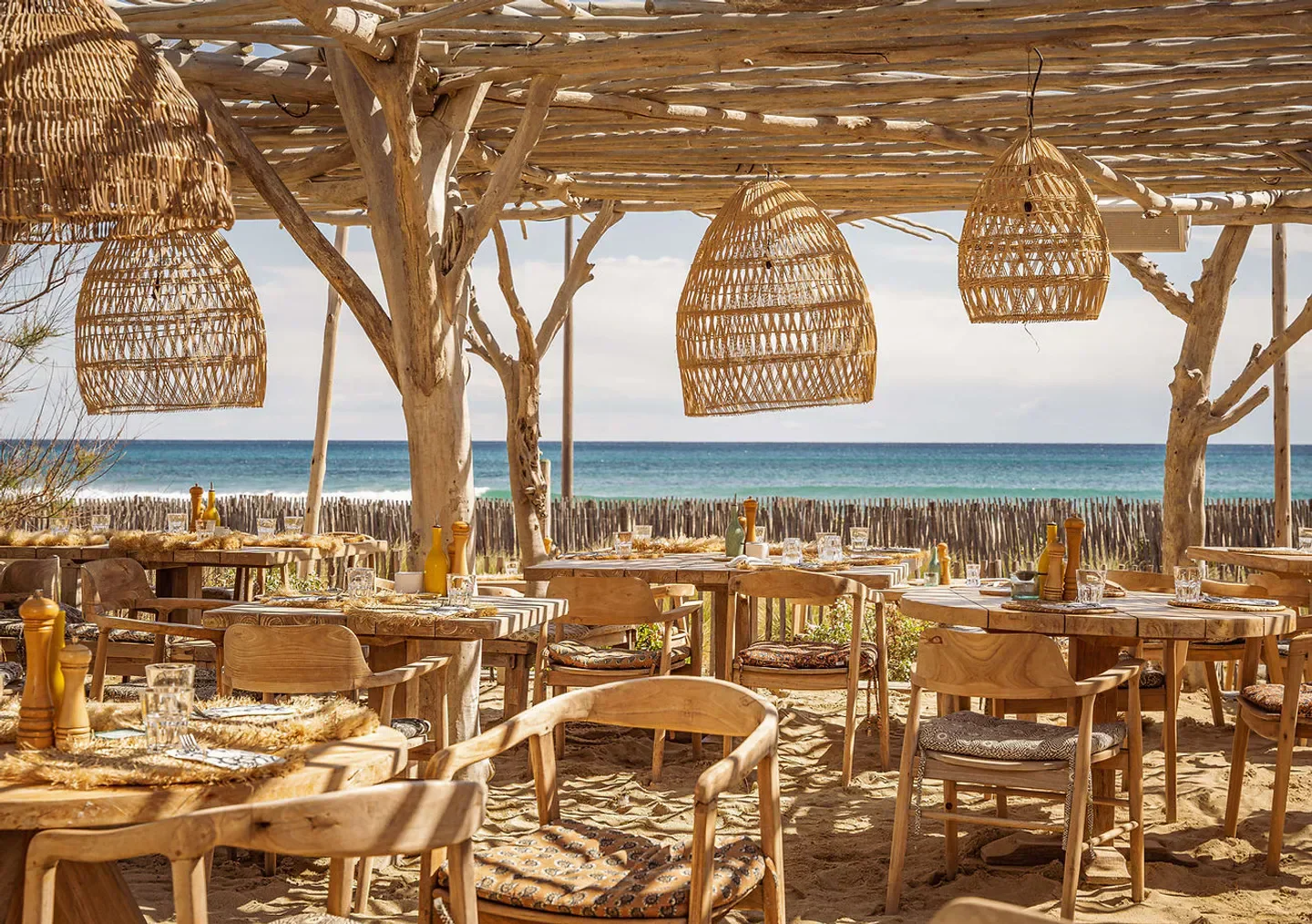 Cabane Bambou restaurant in Saint-Tropez with beach view and stylish decor.