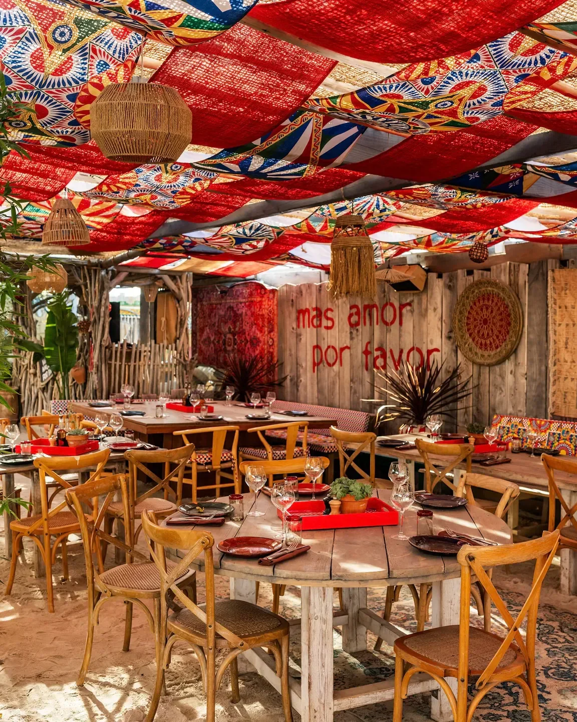 Casa Amor in Saint-Tropez restaurant with vibrant decor and inviting tables set for dining.