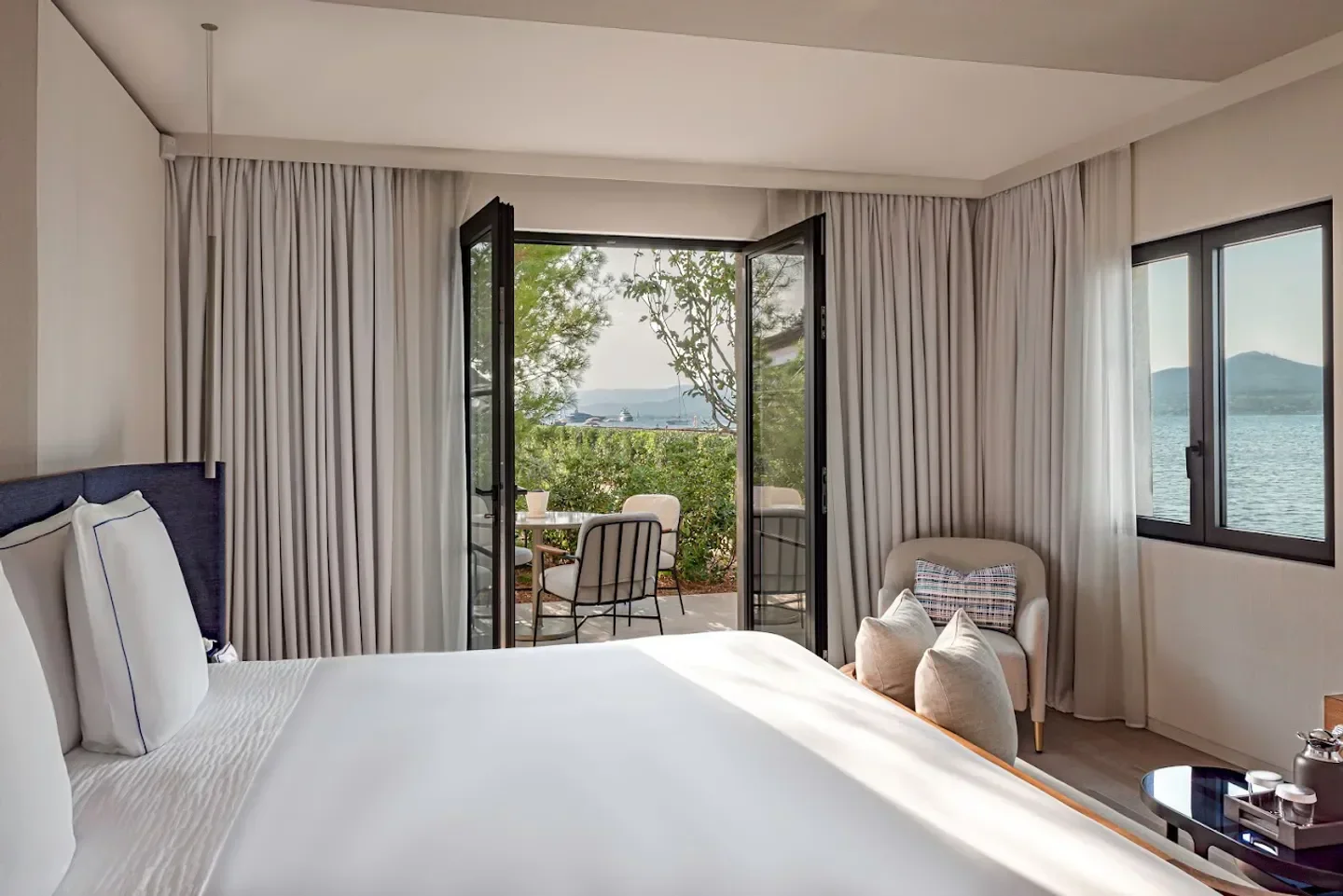 Cheval Blanc St-Tropez bedroom with balcony overlooking the sea in Saint-Tropez.
