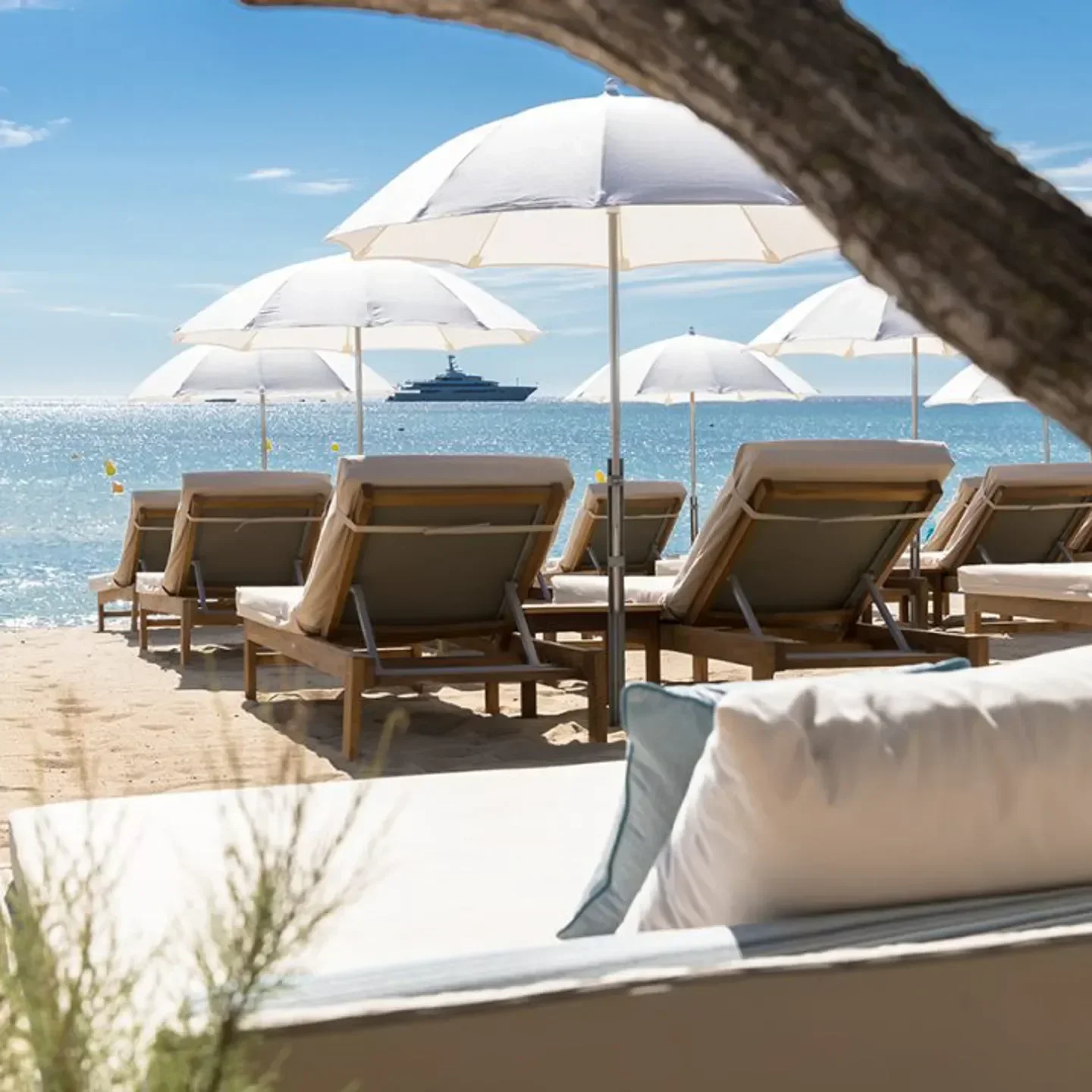 Beach loungers and umbrellas at La Serena Beach in Saint-Tropez, overlooking the Mediterranean Sea