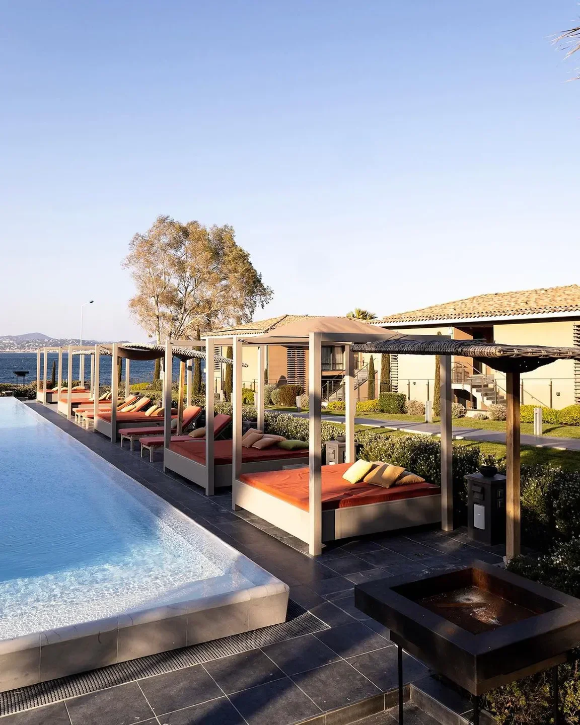Moloko beach club in Saint-Tropez with poolside cabanas and ocean views.