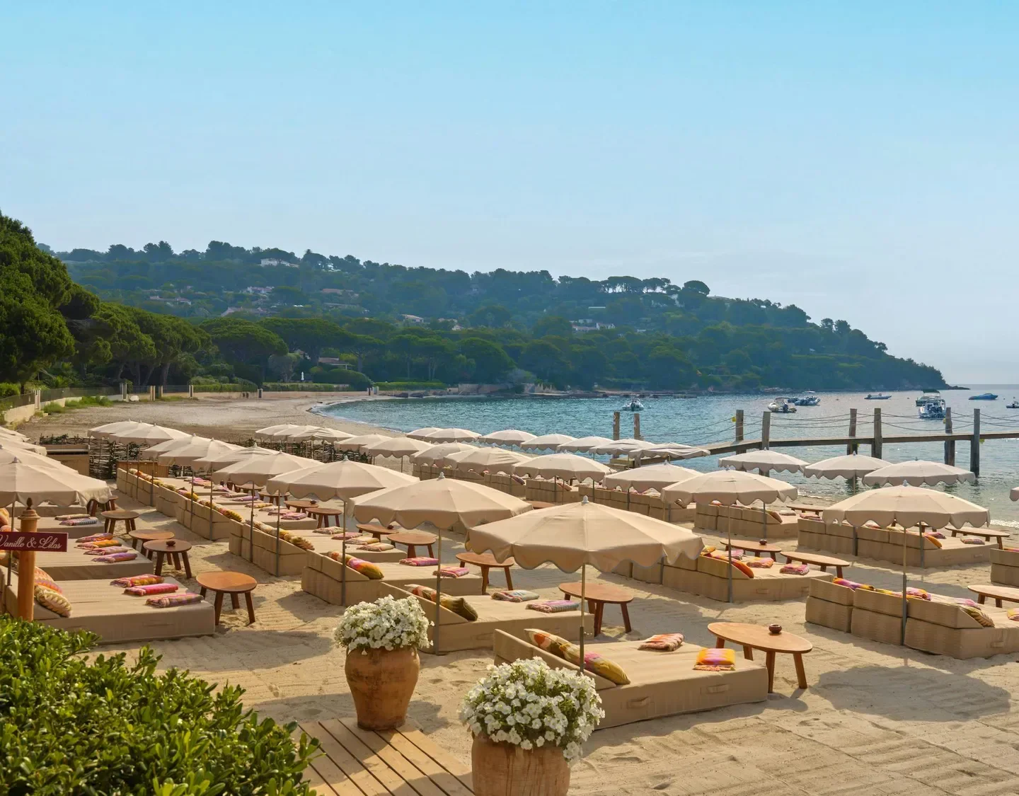 Beach club at Tropezina Beach in Saint-Tropez with sunbeds, umbrellas, and ocean view
