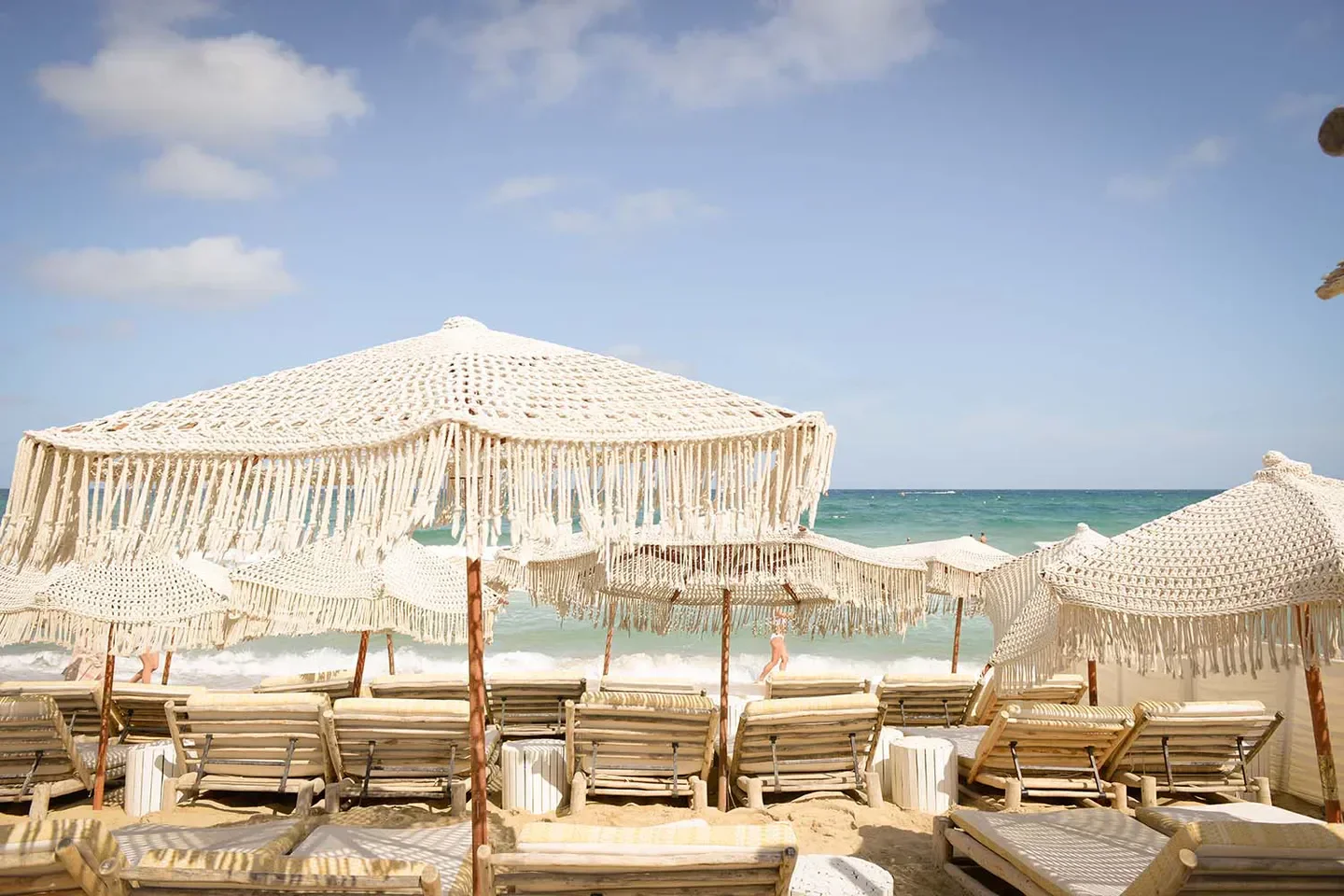 Verde Beach in Saint-Tropez: Beach club with stylish umbrellas and lounge chairs by the sea